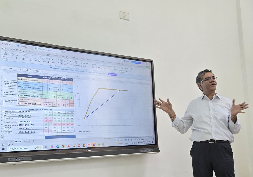 Pradeep Sangal explaining Earned Value Management using a classroom simulator